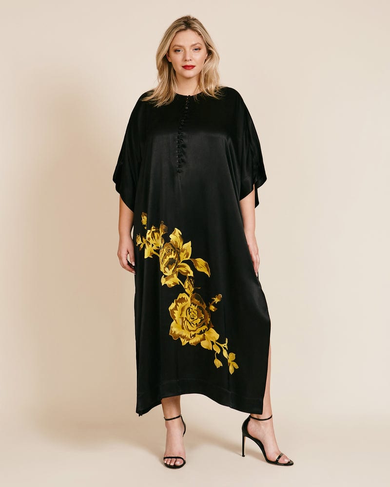 Front of a model wearing a size DK 44 Heavy Satin Dress Kaftan in Black by GANNI. | dia_product_style_image_id:224806